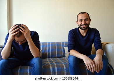 Sad And Happy (manic And Depressive) Emotion Of Same White Middle Aged Male Sitting On A Couch. Bipolar Man. 