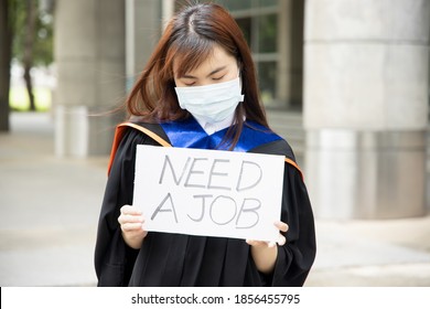 Sad, Hopeless, Jobless Asian College Graduate Student Woman Wearing Face Mask, Concept Of Being Unemployed Due To Job Cut, Employment Disruption After COVID-19 Pandemic Led Economic Recession