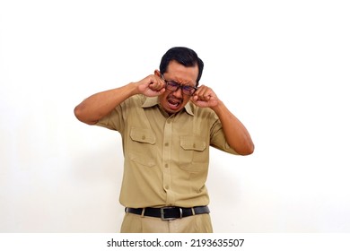 Sad Indonesian Government Employees Standing While Crying Loud. Isolated On White