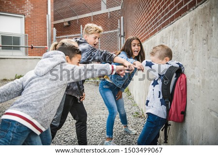 sad intimidation moment Elementary Age Bullying in Schoolyard