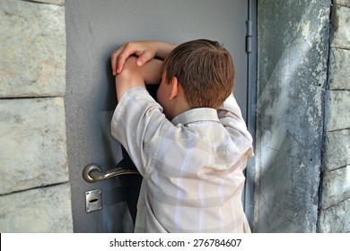 Sad Kid In Front Of Closed Door