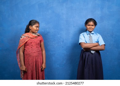 sad kid looking her self in smiling school dress or unifrom - concept of child dreaming about education, deprived schooling and poverty.