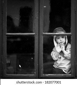 Sad Little Boy, Looking Through The Window