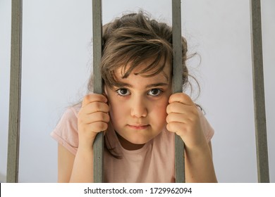 Sad Little Girl Behind Bars Stock Photo 1729962094 