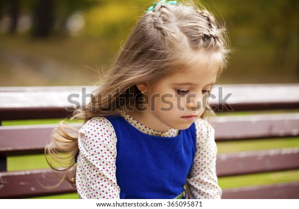 Sad Little Girl Sitting On Bench Stock Photo (Edit Now) 365095871