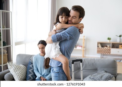 Sad Little Girl Upset By Father Leaving Embracing Dad, Depressed Child Saying Goodbye Hugging Daddy Going Away, Kid And Parents Divorcing Breaking Up, Family Separation, Shared Custody Concept