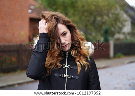 Similar – Image, Stock Photo contemplative young woman in winter jacket