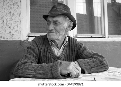 Sad And Lonely Old Man Sitting Alone