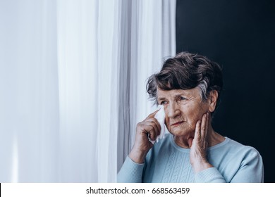 Sad Lonely Older Woman Crying By The Window