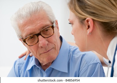 Sad And Lonely Senior Man With Nurse