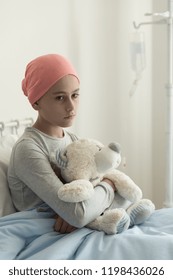 Sad Lonely Sick Girl With Cancer Hugging Plush Toy In The Hospital