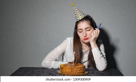 Sad Lonely Woman In Party Hat Celebrating Birthday Alone, Close Up