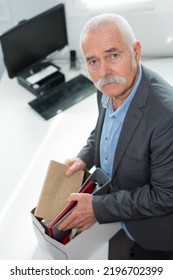 Sad Male Office Worker Tidying Up His Things