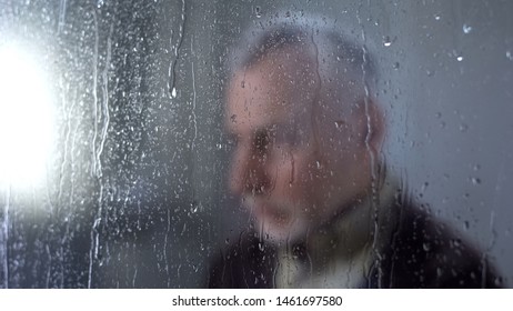 Sad Male Pensioner Feeling Lonely, Rain Drops Window Glass, Melancholy, Problem