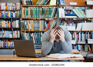 Sad Male Student In The University Library