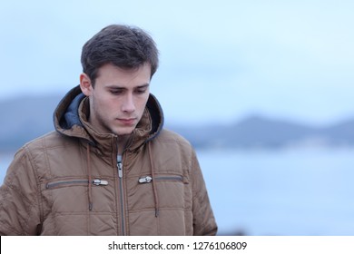 Sad Man Complaining Walking Alone On The Beach In Winter