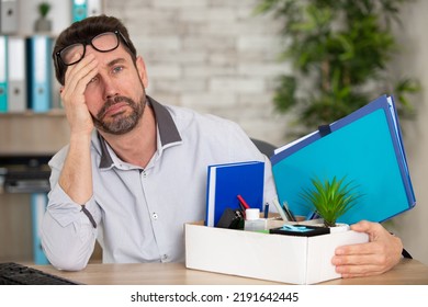 Sad Man With His Office Possessions In A Box