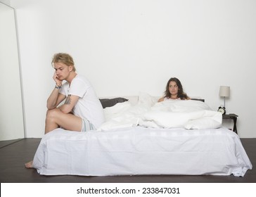 Sad Man And His Wife In Bed