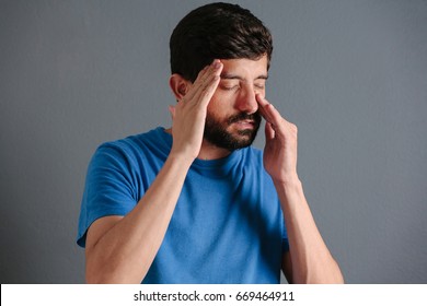 Sad Man Holding His Nose Because Sinus Pain