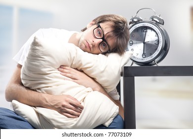 Sad Man Holding Pillow