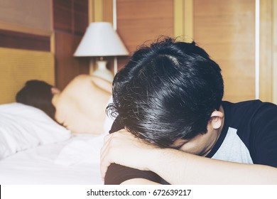 Sad Man With Lady Lie On Bed Background In Hotel, Sex Problem Concept