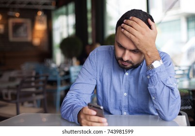 Sad Man Looking On Phone