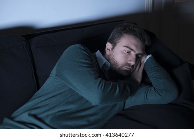 Sad Man Lying On The Couch