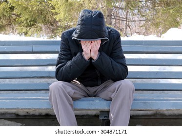 Sad Man On The Bench At The Winter Park