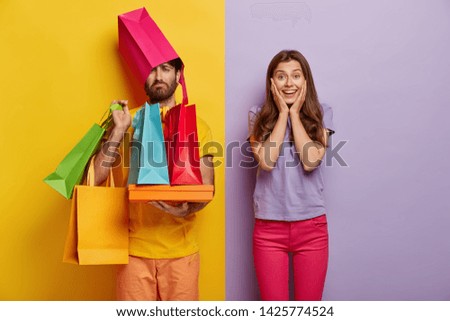 Similar – Yellow shopping bags on a blue background, Shopping concept