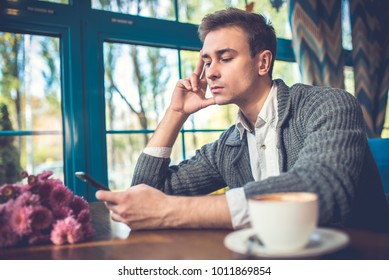 The Sad Man With A Phone Sit In The Restaurant