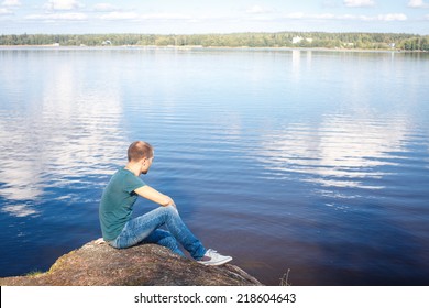 Sad Man Sitting On Rock By Stock Photo 218604643 | Shutterstock