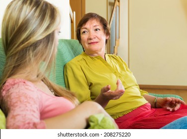 Sad Mature Woman With Adult Daughter  Sharing Bad News At Home