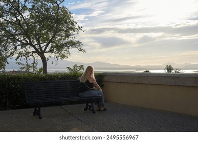 Sad Mature Woman Alone Looking at Panorama - Powered by Shutterstock