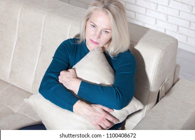 Sad Mature Woman Suffering From Agoraphobia At Home