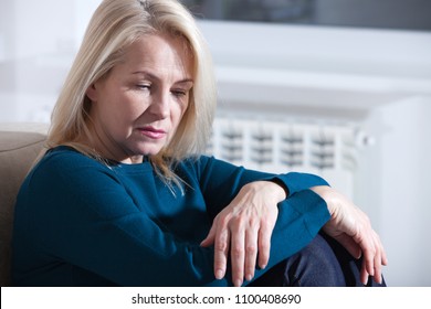 Sad Mature Woman Suffering From Agoraphobia At Home