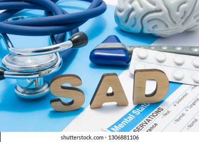 SAD Medical Abbreviation Meaning Seasonal Affective Disorder, Depression Could During Seasons With Little Light. Word SAD Is Surrounded By Stethoscope, Result Of Mental Status Exam, Drugs And Brain