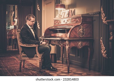 Sad Middle-aged Man In Luxury Vintage Style Interior 