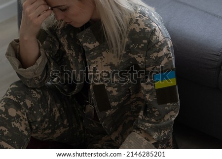 sad military ukrainian woman in uniform