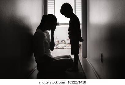 Sad mother and child indoors.  - Shutterstock ID 1832271418