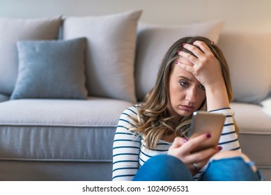  Sad news. Upset young woman with mobile phone reads the message. Closeup portrait upset sad skeptical unhappy serious woman talking texting on phone displeased with conversation - Shutterstock ID 1024096531