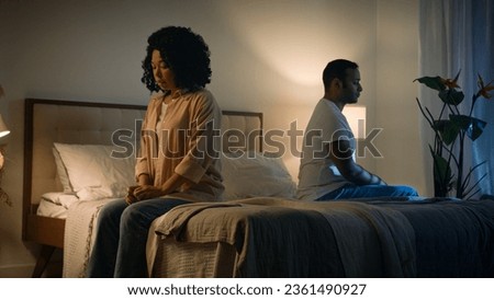 Sad offended African American woman wife feeling bad about breakup problem relationship trouble with erectile dysfunction man husband touch female calming lady walk away couple family on bed at night