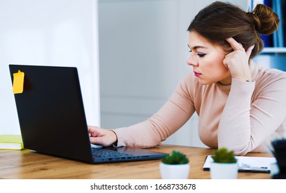 Sad Office Girl Typing On Laptop In Light Office