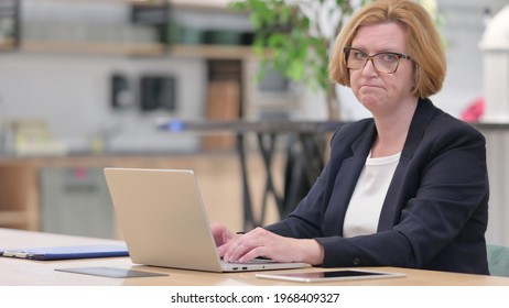 Sad Old Businesswoman with Laptop Rejecting and Feeling Upset