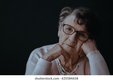 Sad, Old Woman Wearing Eyeglasses, Black Background