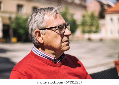 Sad Older Man Thinking About Something While Sitting At The Bar.Depressed Senior Man 
Image Is Intentionally Toned.