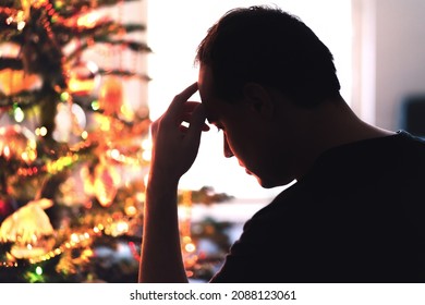 Sad On Christmas. Unhappy, Lonely Or Tired Man With Stress, Grief Or Depression. Family Fight, Loneliness, Frustration Or Money Problem On Xmas. Sick Person With Flu, Pain And Headache On Holiday