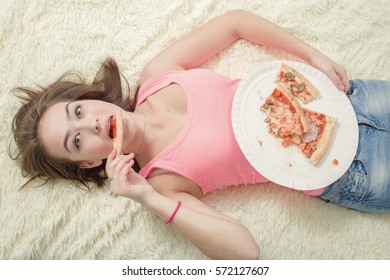 Sad Overeat Girl Lying With Pizza Pieces