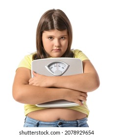 Sad overweight girl with measuring scales on white background