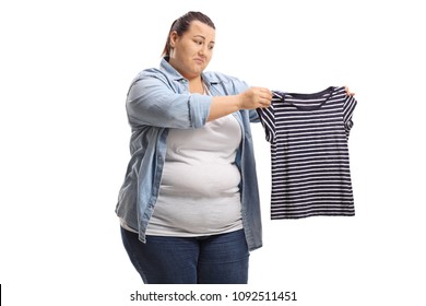 Sad overweight woman with a shrunken shirt isolated on white background