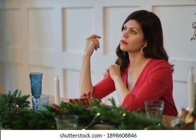 Sad Pensive Mature Woman Sitting At Dining Table And Celebrating Birthday Alone At Home. Frustration, Happiness, Holidays Concept